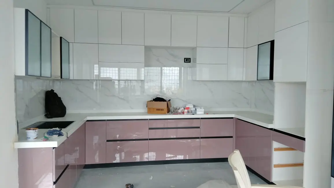 Pink high-gloss U-shaped modular kitchen with white wall units, Pune